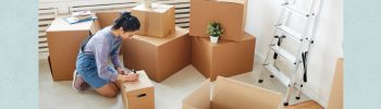 Photo of woman sorting things into boxes.
