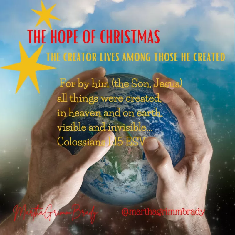 Photo of hands creating the world on blue background.