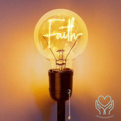 light bulb that is turned on showing the word Faith. Gold background.